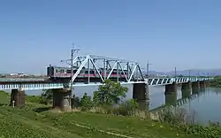701 series passing Omonogawa Bridge