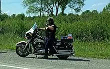 An Ontario Provincial Police officer on a Harley-Davidson FLHP