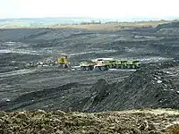 A large pit of coal