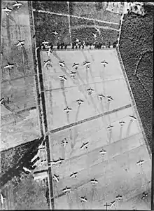 Aerial view of fields covered in abandoned gliders