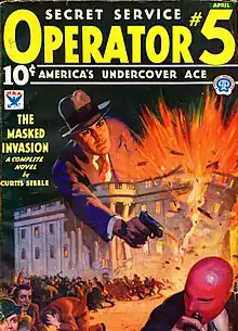 A crowd flees a burning building, over which leans a giant man firing a handgun.