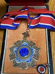 Picture of the Order of The Brilliant Jade Medal on red, white and blue ribbon with and Lapel Pin