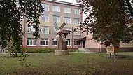 Monument to the mill next to Oryol SAU Multidisciplinary College building