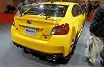 Subaru WRX STI S207, a limited-production high-performance automobile. This is a rear view of the car, showing its yellow color, high trunk-mounted spoiler, and nameplate.
