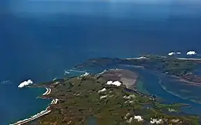 A 1200-metre-long mole at Aramoana (centre left of image), protects the mouth of New Zealand's Otago Harbour