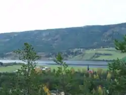 View of the village of Otnes and the lake Lomnessjøen