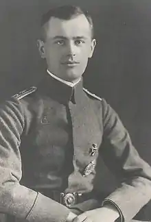 Black-and-white photo of a man wearing a military uniform.