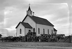 Parishioners outside Our Lady of Lourdes Roman Catholic Church in 1930