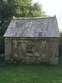 Stone outbuilding incorporating early stone crosses