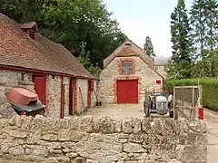 Outbuildings, with main house in the background