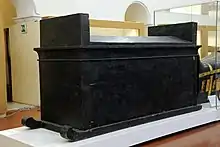Black painted wooden box with sledge runners
