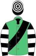 Emerald green, black sash, black and white hooped sleeves, black and white hooped cap