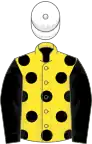 Yellow, black spots and sleeves, white cap