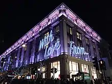 A grand shop covered in Christmas lights