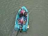 Fishing from a boat on the Doubs, France