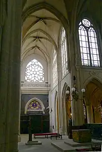 The north transept. The original rose window glass was destroyed in a workshop fire in 2009, and was replaced by clear glass.