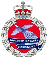 The emblem of the Royal Papua New Guinea Constabulary featuring featuring the Crown