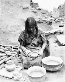 Hopi Woman of Oraibi, Third Mesa, making coiled pottery