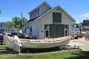 a U.S. Coast Guard rescue dinghy in front of the Padnos Boat Shed