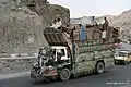 Typical Pakistani transport truck and passengers