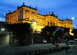 Main façade at night.