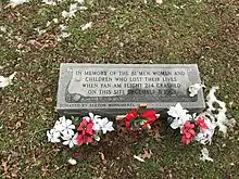 Short rectangular granite monument that reads, "In memory of the 81 men, women and children who lost their lives when Pan Am Flight 214 crashed on this site December 8, 1963.  Donated by Elkton Monuments"