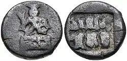 Coin of the Panchalas of Ahichhatra (75-50 BCE).Obv Indra seated facing on pedestal, holding bifurcated object.Rev Idramitrasa in Brahmi, Panchala symbols.