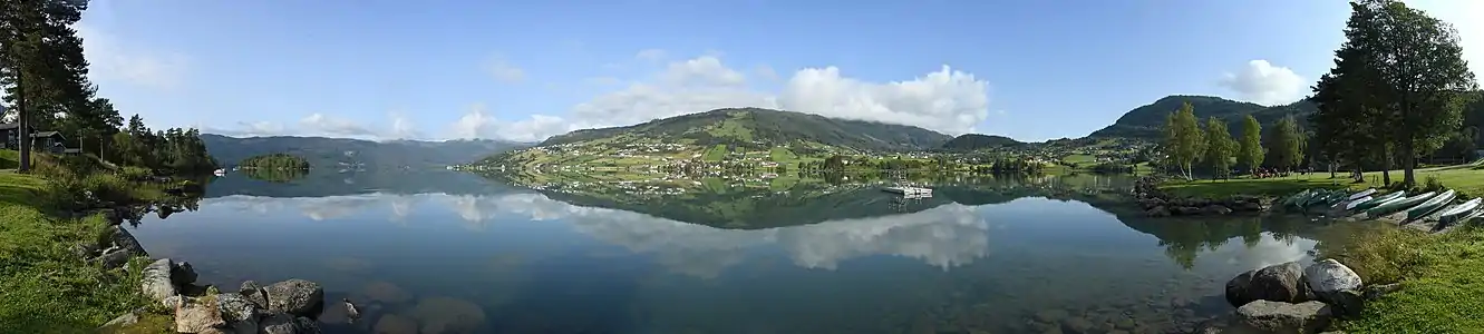 Panorama of Hafslovatnet with the village Hafslo visible across the lake in the center of the image