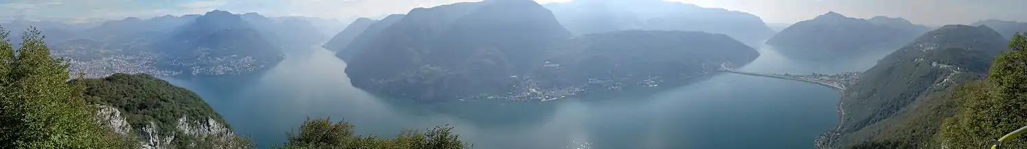 View of Lake Lugano from Monte San Salvatore, with Lugano to the left and the Melide causeway to the right