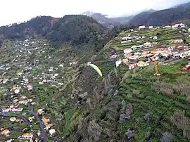 A paraglider over the locality of Achada de Santo Antão