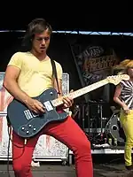 Josh Farro playing a guitar