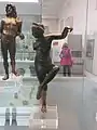 A small bronze sculpture of Venus loosening her sandal