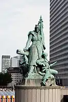 The name of the district comes from the statue of La Défense de Paris by Louis-Ernest Barrias which commemorates the Parisian resistance during the Franco-Prussian War.