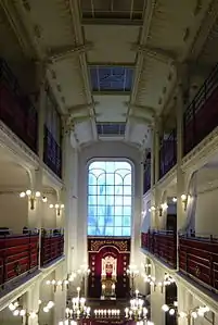 Interior view, showing the nave, the galleries and the back wall.