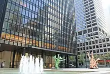 Looking toward the southeast within the building's plaza. There is a fountain at the left center.