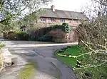 Slyfield Farmhouse, with attached garden wall