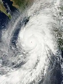 Satellite image of an extremely intense Hurricane Patricia on September 23, sporting a pinhole eye and a symmetric central dense overcast