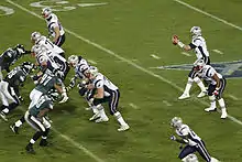 The Patriots lined up in front of Brady as he receives a snap