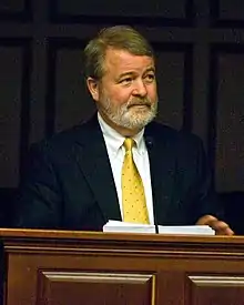 Professor Lombardo in 2011, speaking at a podium.