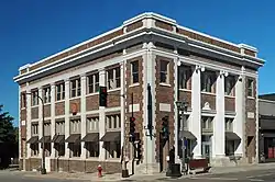 Two-story brick building with engaged columns on a corner lot