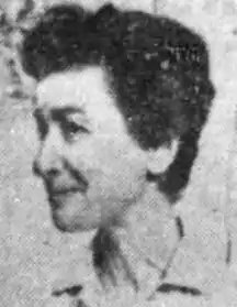 A middle-aged white woman with short dark hair