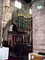 The wrought iron chancel gates of Dutch origin, dated 1778. The organ, formerly in the tower arch, was moved to present position in 1881.