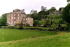 The 18th-century mansion (left) and the remains of the castle (right)