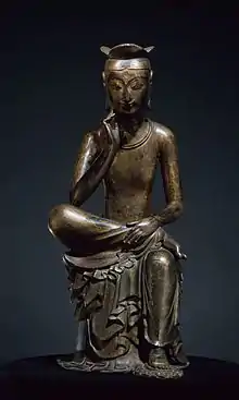 Pensive Bodhisattva Maitreya, Silla,  late 6th or early 7th century.  Gilt bronze, h. 93.5 cm. National Treasure no. 83. National Museum of Korea.