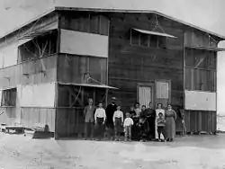 Rev. Ora Rush Weed and his family in front of their home in 1912.