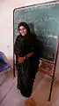 Sahrawi woman teaching Spanish in one of the Tindouf refugee camps.