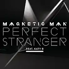 A portrait of little table and the dark floor and the white line. Performer and single is 'MAGNETIC MAN PERFECT STRANGER FEAT. KATY B'