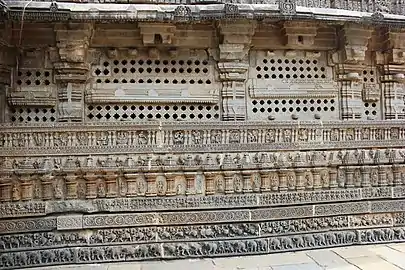 Wall relief, pierced windows and molding frieze