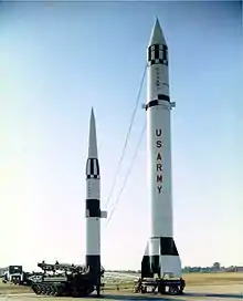 Pershing missile next to Redstone missile illustrating the difference in height and range