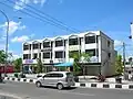 A row of six reinforced concrete shophouses in Pekanbaru, Indonesia.
